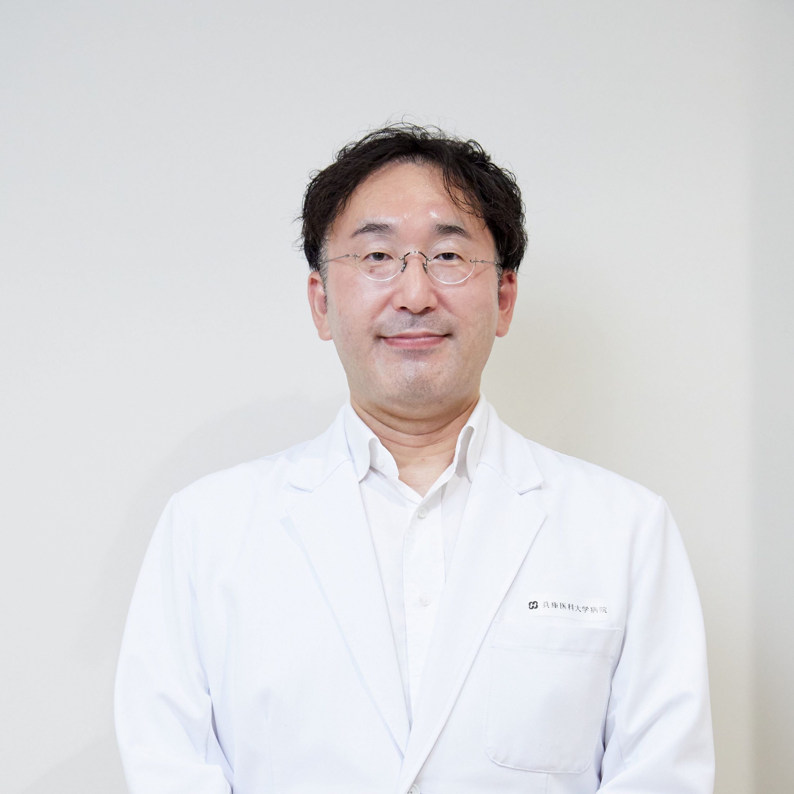 吉田 賀一
